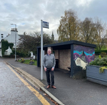 Jackson Carlaw at a bus stop in Eaglesham